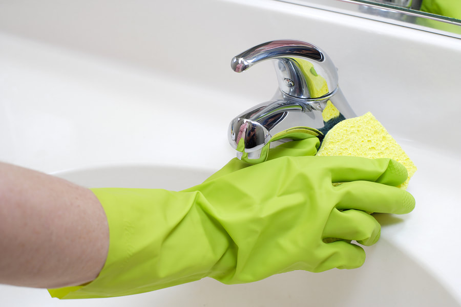 worker wiping the faucet, House Cleaning Services