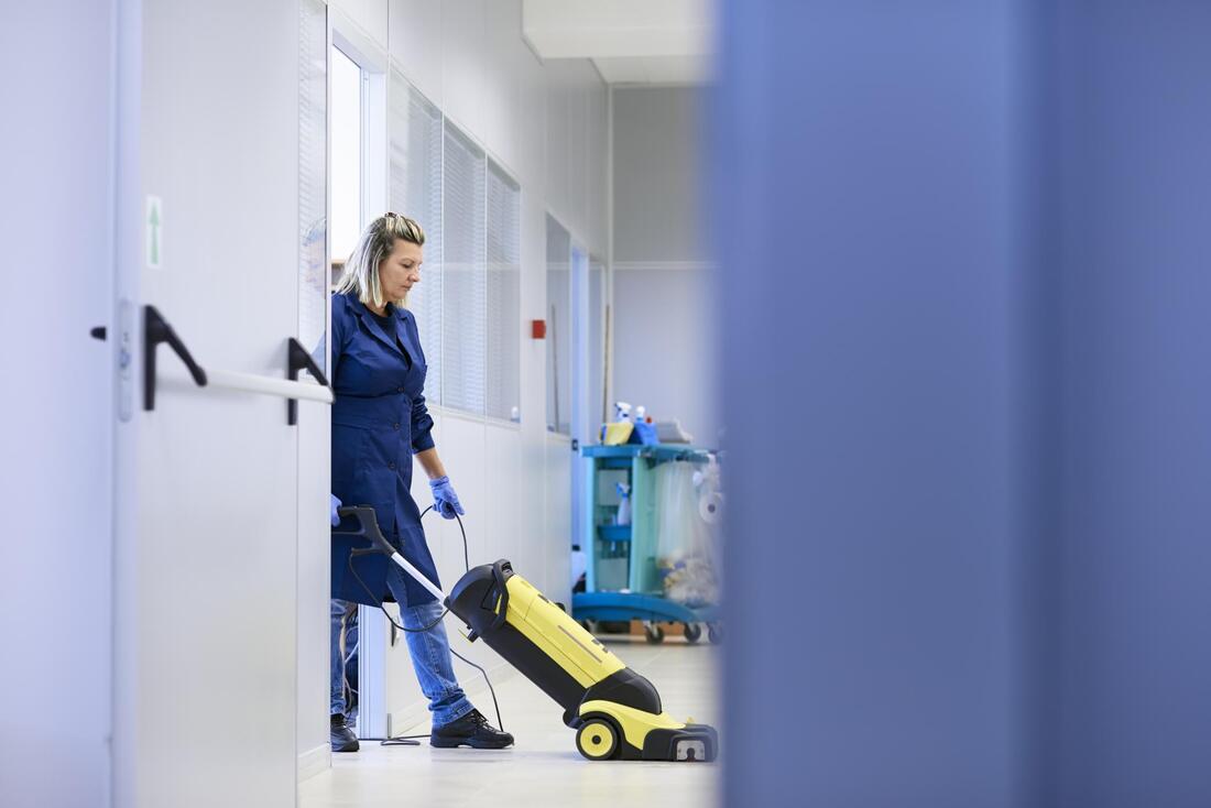 woman cleaning the hallway