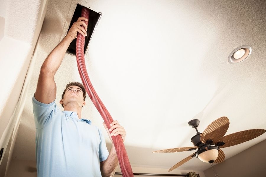 worker wiping the faucet, House Cleaning Services,Duct Cleaning in Grande Prairie